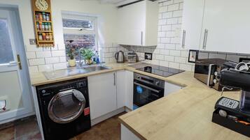 Fridge, electric kettle, toaster, cookware/dishes/utensils