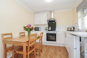 Fridge, electric kettle, toaster, cookware/dishes/utensils