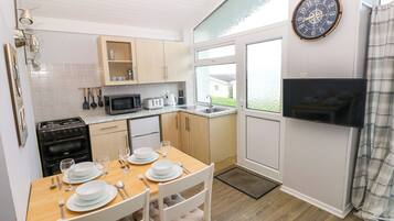 Fridge, electric kettle, toaster, cookware/dishes/utensils