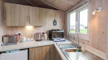 Fridge, electric kettle, toaster, cookware/dishes/utensils