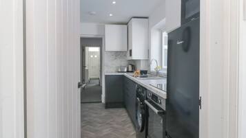 Fridge, electric kettle, toaster, cookware/dishes/utensils