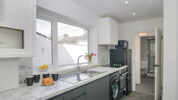 Fridge, electric kettle, toaster, cookware/dishes/utensils