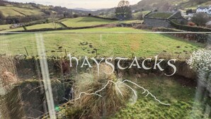 A rural landscape with fields and stone walls, labeled "haystacks". - Haystacks (Windermere)