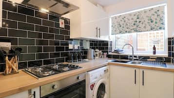 Fridge, electric kettle, toaster, cookware/dishes/utensils