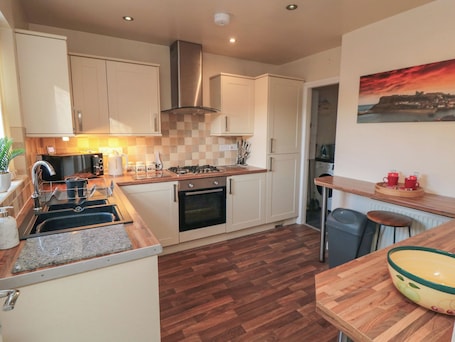 Fridge, electric kettle, cookware/dishes/utensils