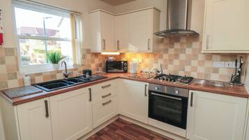 Fridge, electric kettle, cookware/dishes/utensils