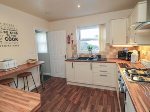Fridge, electric kettle, cookware/dishes/utensils