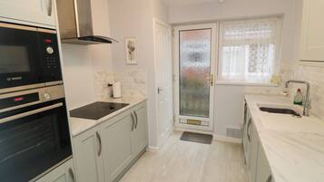 Fridge, dishwasher, electric kettle, cookware/dishes/utensils