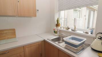 Fridge, electric kettle, toaster, cookware/dishes/utensils