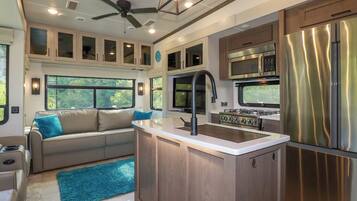 Fridge, electric kettle, toaster, cookware/dishes/utensils