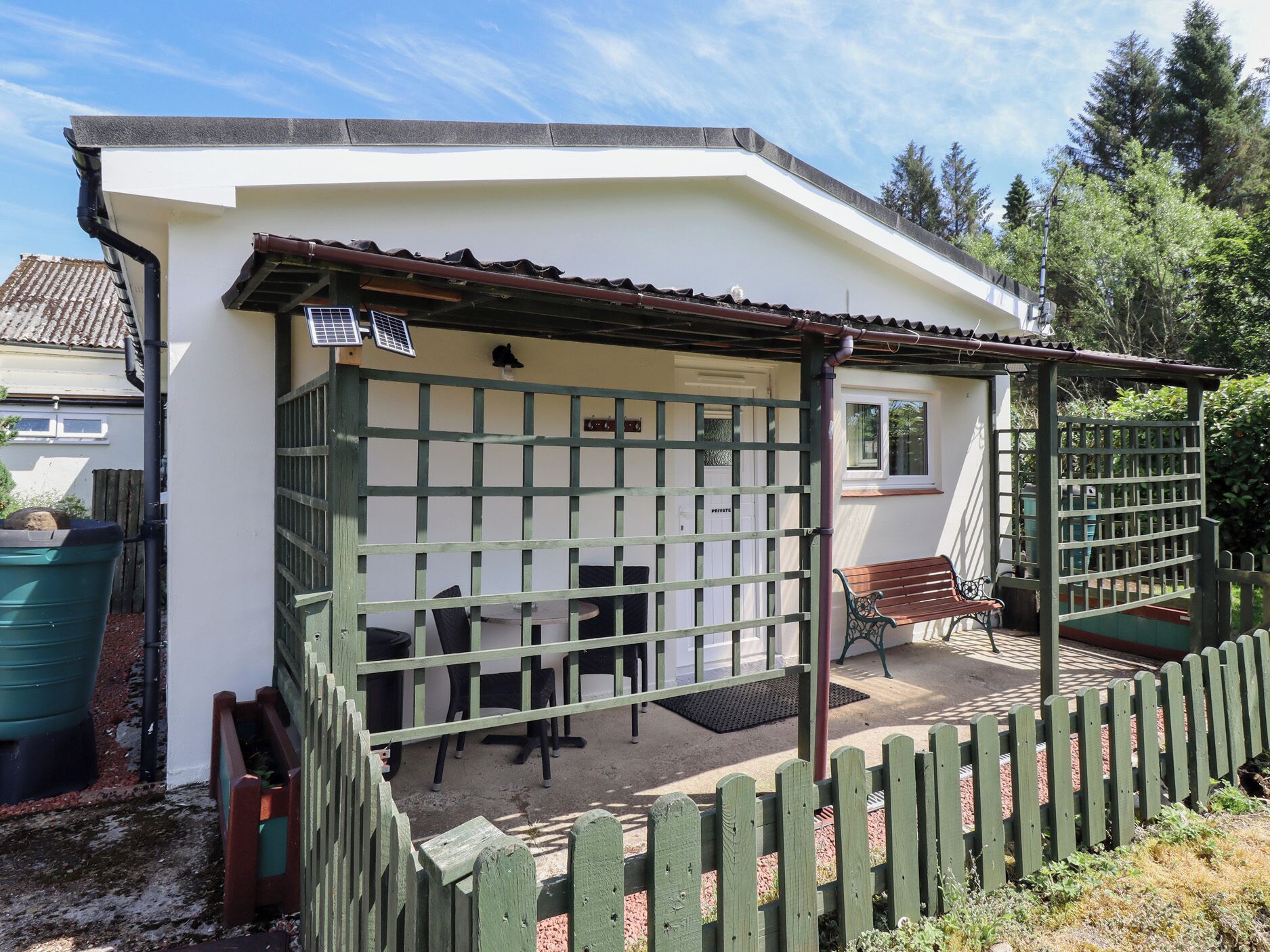 A small, single-story building with a covered patio area.