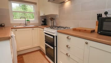 Fridge, electric kettle, toaster, cookware/dishes/utensils