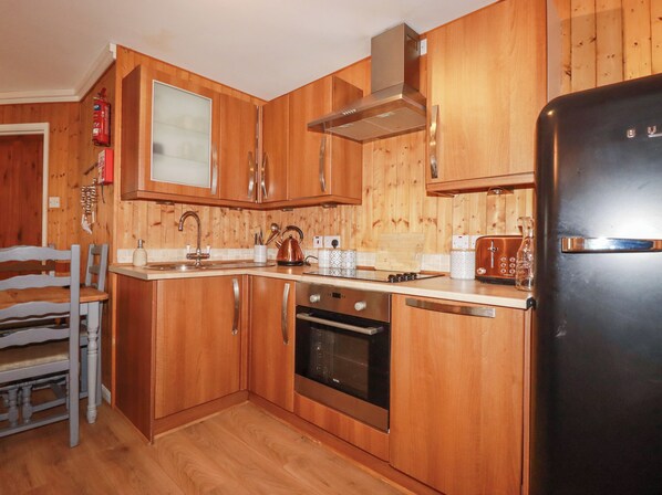 Fridge, electric kettle, cookware/dishes/utensils