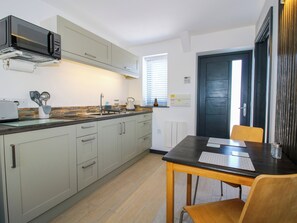 Fridge, electric kettle, toaster, cookware/dishes/utensils