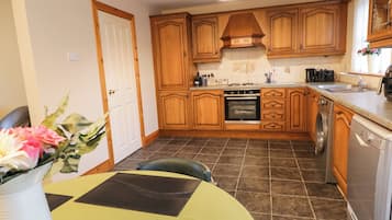 Fridge, electric kettle, toaster, cookware/dishes/utensils