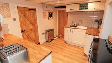 Fridge, electric kettle, toaster, cookware/dishes/utensils