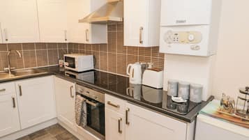 Fridge, electric kettle, toaster, cookware/dishes/utensils