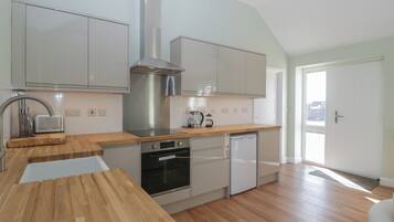 Fridge, electric kettle, toaster, cookware/dishes/utensils