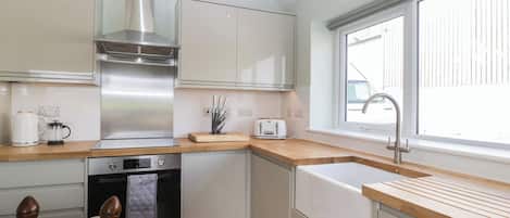 Fridge, electric kettle, toaster, cookware/dishes/utensils