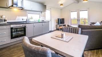 Fridge, electric kettle, cookware/dishes/utensils