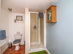 A bathroom with a toilet, bidet, and shower. - Seaforest Lodge (Gorey)