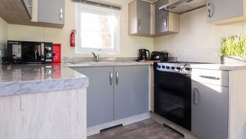 Fridge, electric kettle, toaster, cookware/dishes/utensils