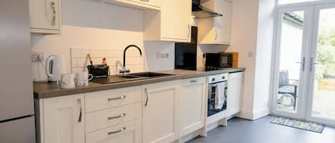 Fridge, dishwasher, electric kettle, cookware/dishes/utensils