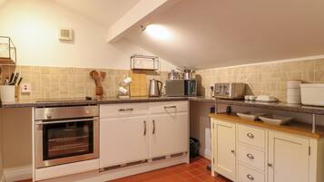 Fridge, electric kettle, toaster, cookware/dishes/utensils