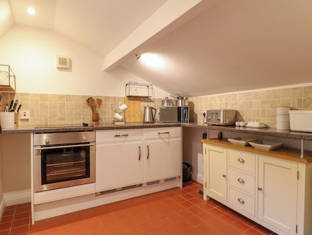 Fridge, electric kettle, toaster, cookware/dishes/utensils