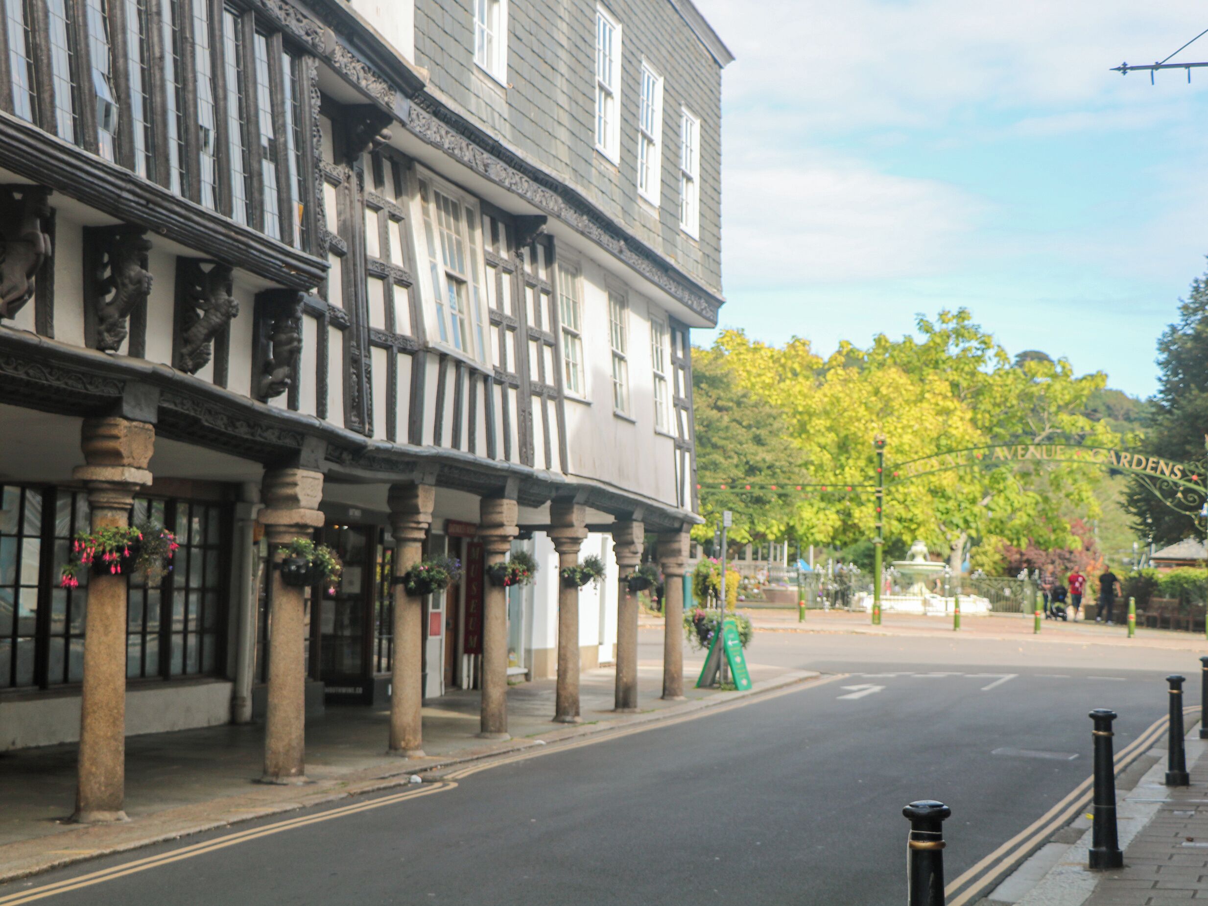A traditional half-timbered building with a street in front.