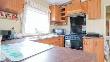 Fridge, electric kettle, toaster, cookware/dishes/utensils