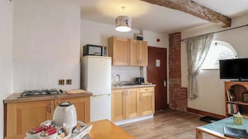 Fridge, electric kettle, cookware/dishes/utensils