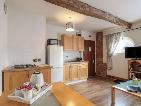 Fridge, electric kettle, cookware/dishes/utensils