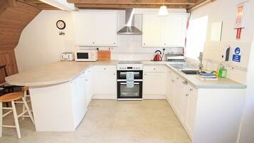 Fridge, electric kettle, toaster, cookware/dishes/utensils