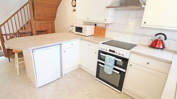 Fridge, electric kettle, toaster, cookware/dishes/utensils