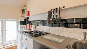 Fridge, electric kettle, cookware/dishes/utensils