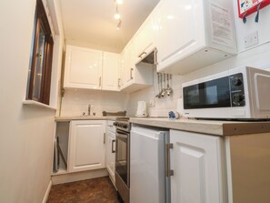 Fridge, electric kettle, toaster, cookware/dishes/utensils