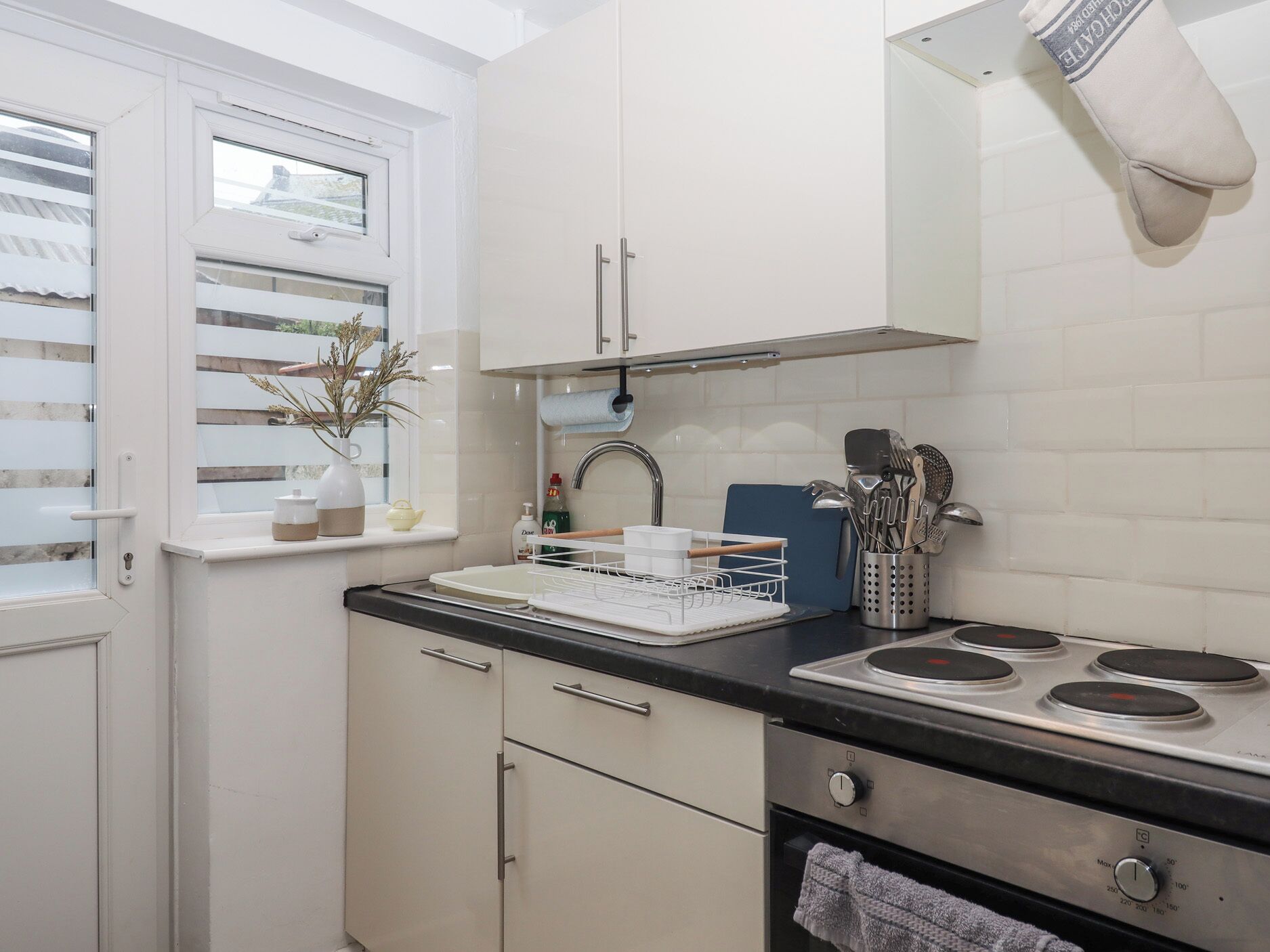 Fridge, electric kettle, toaster, cookware/dishes/utensils