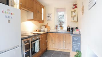 Fridge, electric kettle, cookware/dishes/utensils