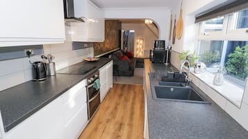 Fridge, electric kettle, toaster, cookware/dishes/utensils