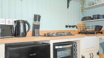 Fridge, toaster, cookware/dishes/utensils