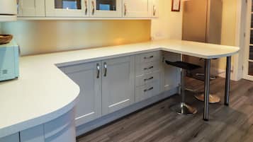 Fridge, electric kettle, toaster, cookware/dishes/utensils