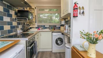 Fridge, electric kettle, toaster, cookware/dishes/utensils