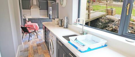 Fridge, dishwasher, electric kettle, cookware/dishes/utensils