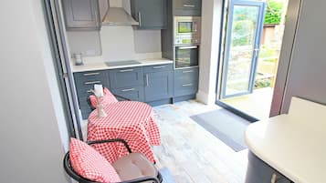 Fridge, dishwasher, electric kettle, cookware/dishes/utensils