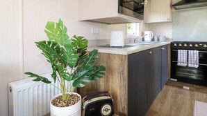 Fridge, electric kettle, toaster, cookware/dishes/utensils