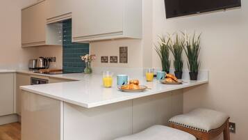 Fridge, electric kettle, cookware/dishes/utensils