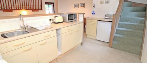 Fridge, electric kettle, toaster, cookware/dishes/utensils