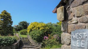 A stone building with a sign reading "WEST LEE". - West Lee (Bude)