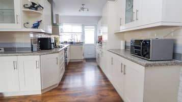 Fridge, electric kettle, toaster, cookware/dishes/utensils